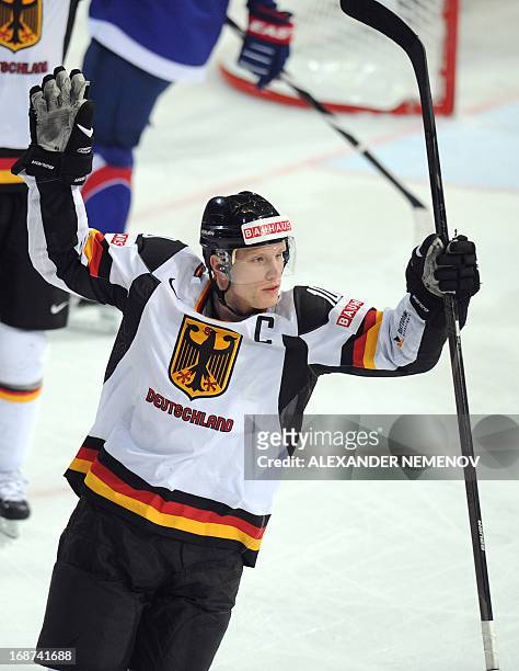 Germany's defender Christian Ehrhoff celebrates an overtime winning goal during a preliminary round game France vs Germany of the IIHF International...