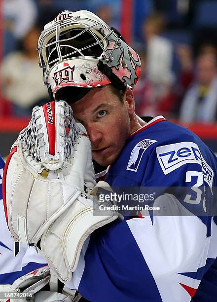 Cristobal Huet, goaltender of France looks dejected after the IIHF World Championship group H match between France and Germany at Hartwall Areena on...