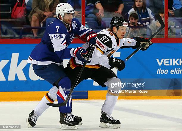 Yorick Treille of France skates against Philip Gogulla of Germany during the IIHF World Championship group H match between France and Germany at...