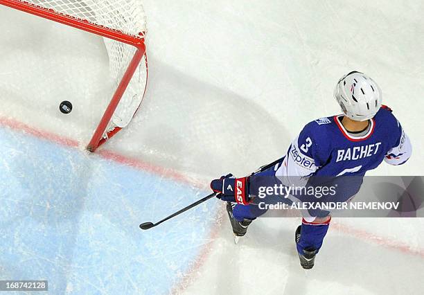 French defender Vincent Bachet skates by his net with a puck in it during a preliminary round game France vs Germany of the IIHF International Ice...