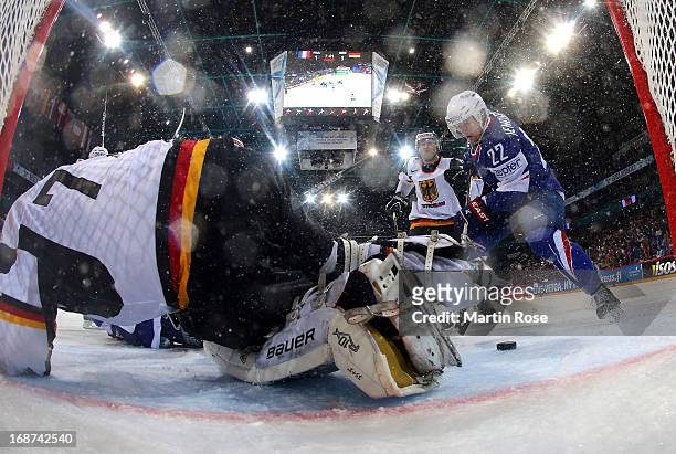 Brian Henderson of France fails to score over Rob Zepp , goaltender of Germany during the IIHF World Championship group H match between France and...