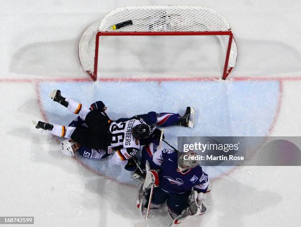 Yannic Seidenberg of Germany lies on Jonathan Janil of France during the IIHF World Championship group H match between France and Germany at Hartwall...