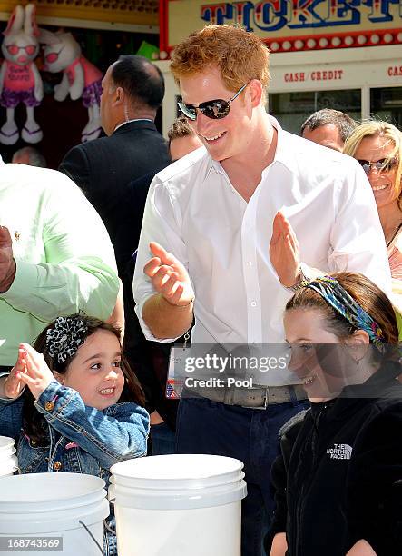 Prince Harry joins children playing ball games on the Pier at Seaside Heights, New Jersey with Governor of New Jersey during his visit to...