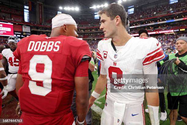 Joshua Dobbs of the Arizona Cardinals and Daniel Jones of the New York Giants embrace after the game at State Farm Stadium on September 17, 2023 in...