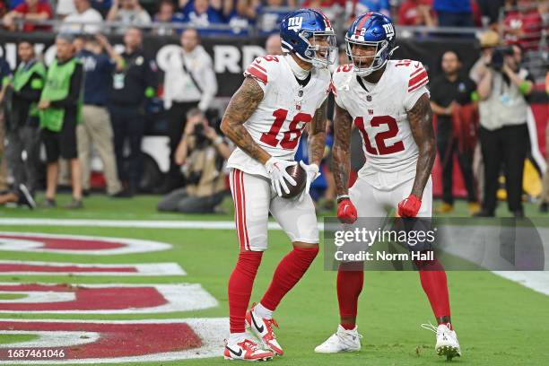 Isaiah Hodgins of the New York Giants celebrates a touchdown with Darren Waller during the fourth quarter in the game against the Arizona Cardinals...