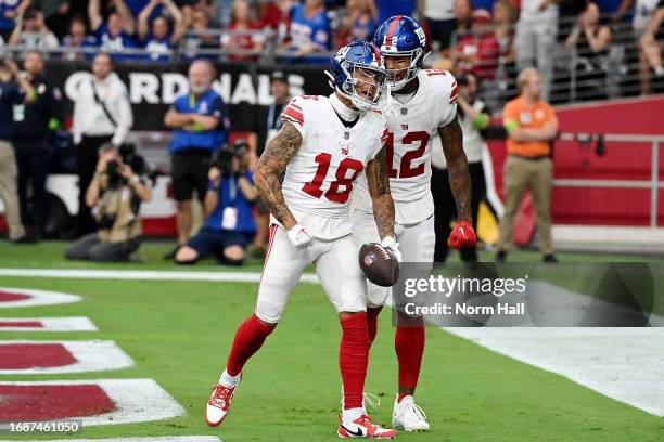 Isaiah Hodgins of the New York Giants celebrates a touchdown with Darren Waller during the fourth quarter in the game against the Arizona Cardinals...