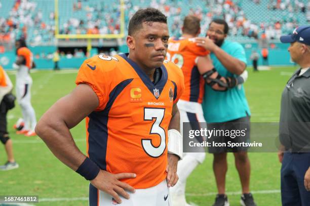 Denver Broncos quarterback Russell Wilson shows his disappointment following the game between the Denver Broncos and the Miami Dolphins on Sunday,...