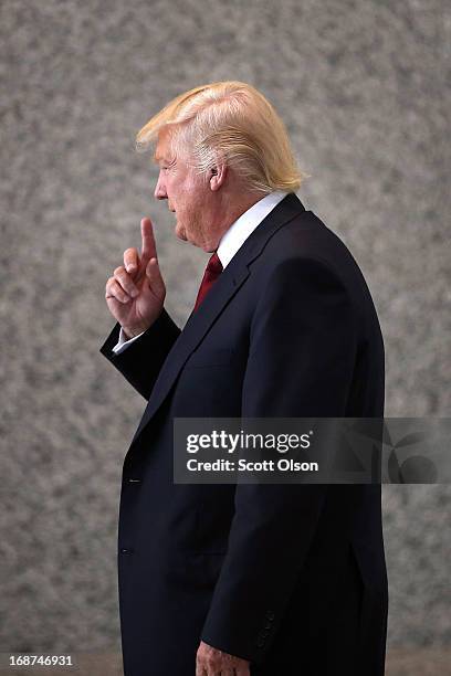 Donald Trump arrives at the Dirksen Federal Courthouse to testify in a civil case involving his Trump Tower on May 14, 2013 in Chicago, Illinois....