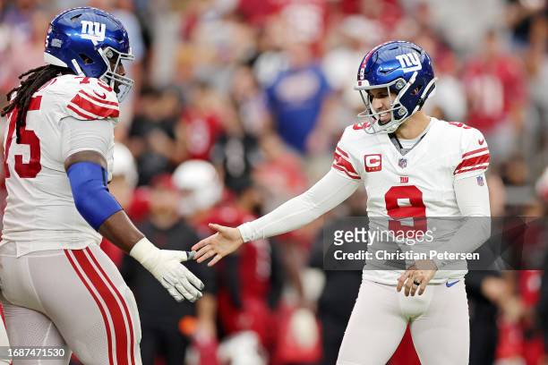 Graham Gano of the New York Giants celebrates a field goal during the fourth quarter in the game against the Arizona Cardinals at State Farm Stadium...