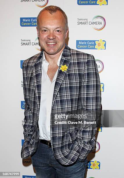 Graham Norton attends the launch of Samsung's NX Smart Camera at a charity auction with David Bailey in aid of Marie Curie Cancer Care at the Bulgari...