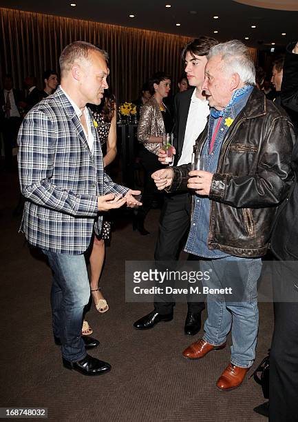 Graham Norton, Sascha Bailey and David Bailey attend the launch of Samsung's NX Smart Camera at a charity auction with David Bailey in aid of Marie...