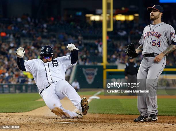 Prince Fielder of the Detroit Tigers scores from third base on a wild pitch thrown by Travis Blackley of the Houston Astros in the sixth inning at...