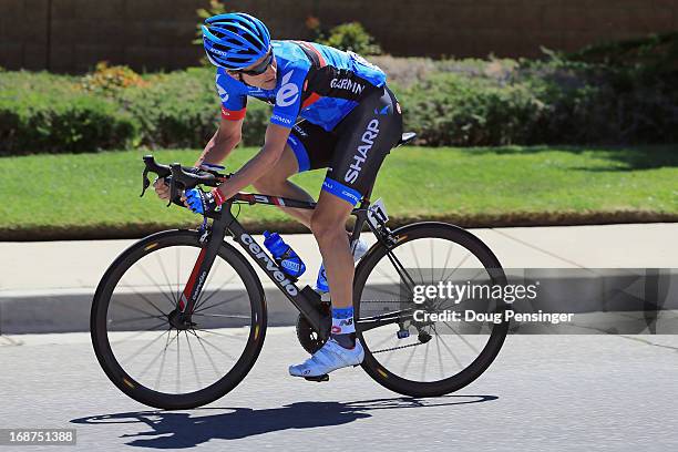 David Zabriskie of the USA riding for Garmin-Sharp looks back at the peloton as he launches an attack early during Stage Three of the 2013 Amgen Tour...