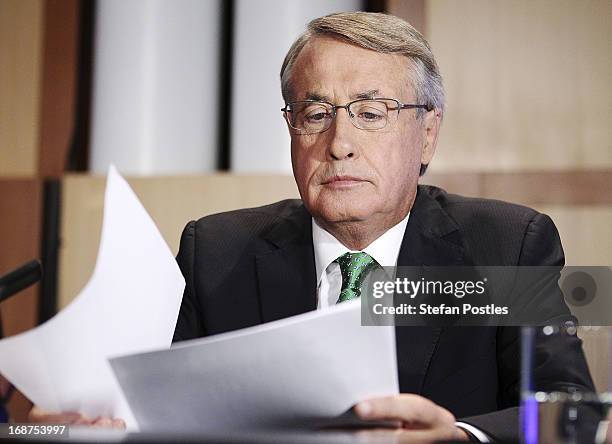 Deputy Prime Minister and Treasurer Wayne Swan prepares to give his post Budget Press Club address in the Great Hall on May 15, 2013 in Canberra,...