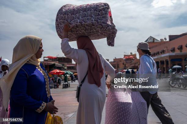 Woman carries baskets on her head at the Souk on September 17, 2023 in Marrakech, Morocco. An earthquake measuring 6.8 on the Richter scale hit...