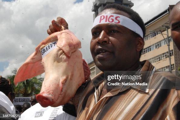 Pigs Protesting A protestor carries the head of a pig during a protest on May 14 ...