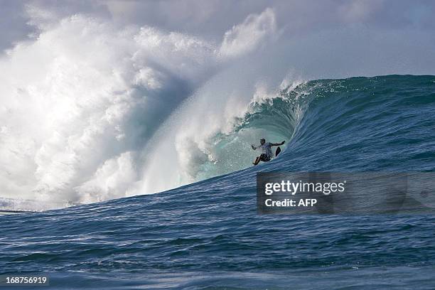 Surfer falls in a wipeout at Teahupoo in Tahiti on May 14, 2013. Top surfers in the world gathered in Teahupoo since the beginning of the week to...