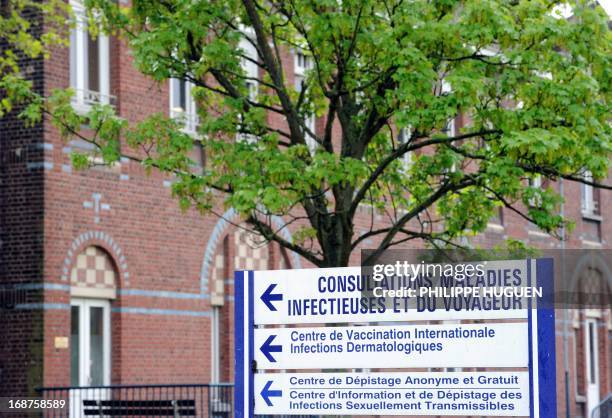 Picture taken on May 14, 2013 shows a sign reading ''infectious and travel diseases consultations, international vaccination centre and free and...