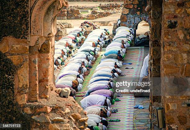 friday prayers - feroz shah mosque - shah mosque stock pictures, royalty-free photos & images