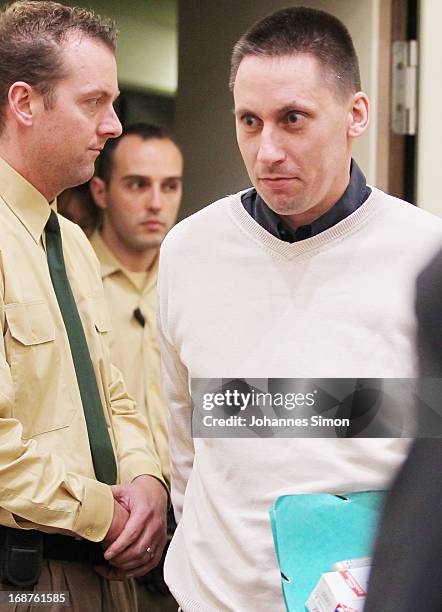 Defendant Ralf Wohlleben arrives in the courtroom on day three of the NSU neo-Nazis murder trial at the Oberlandgericht Muenchen court on May 15,...