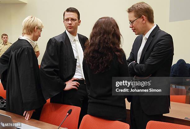 Lawyers Anja Sturm , Wolfgang Stahl and Wolfgang Heer chat with their client Beate Zschaepe in the courtroom on day three of the NSU neo-Nazis murder...