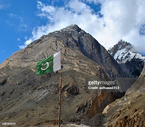 homeland of mountains - pakistani flag stock pictures, royalty-free photos & images