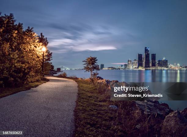 detroit, michigan - skyline at dusk - detroit michigan stock pictures, royalty-free photos & images