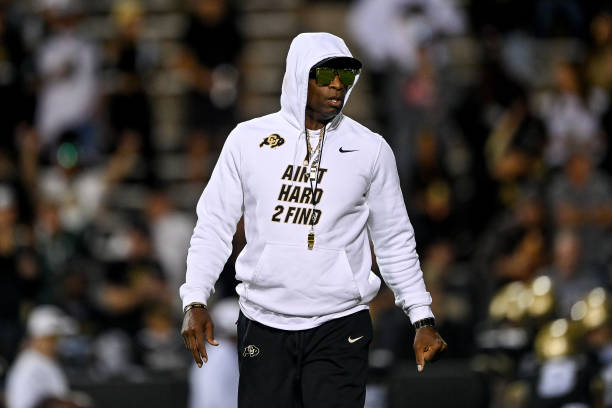 Head coach Deion Sanders of the Colorado Buffaloes walks onto the field as players warm up before a game against the Colorado State Rams in Folsom.