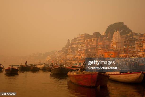 varanasi at sunrise with golden light and boats. - ganges river stock pictures, royalty-free photos & images