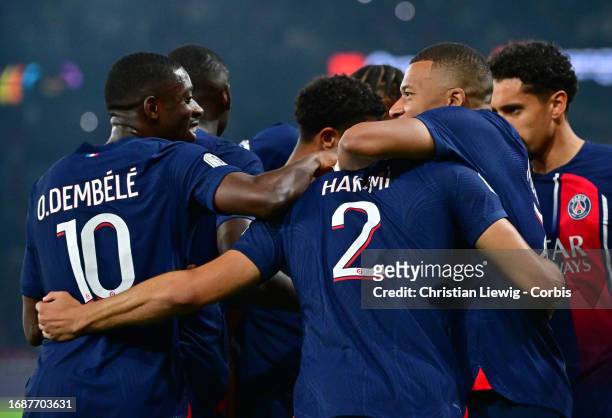 Achraf Hakimi of Paris Saint-Germain celebrates his first goal with teammattes of Paris Saint-Germain in action during the French First League...