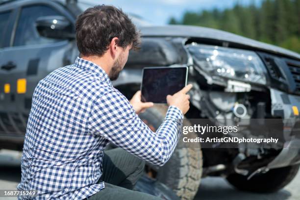 insurance adjuster inspecting car. - claim form stock pictures, royalty-free photos & images