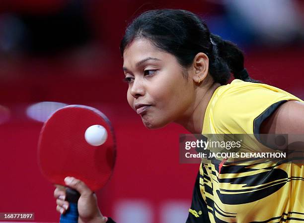 India's Mouma Das serves a ball to Hong-Kong Lee Ho Ching during the first round of the Women's Singles competition at the World Table Tennis...