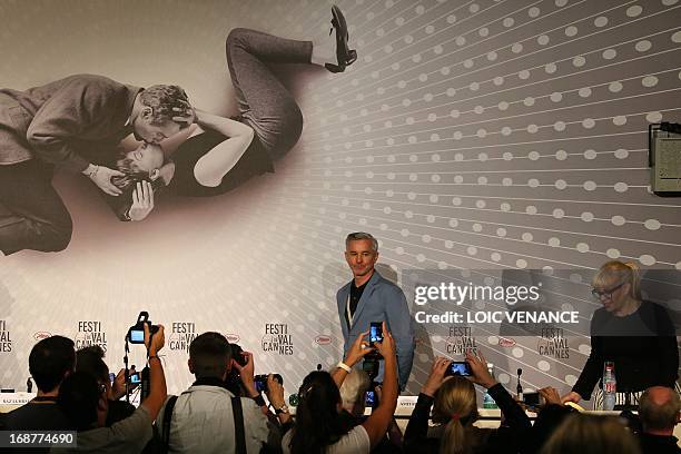 Australian director Baz Luhrmann arrives on May 15, 2013 with his wife Australian production designer Catherine Martin to attend a press conference...