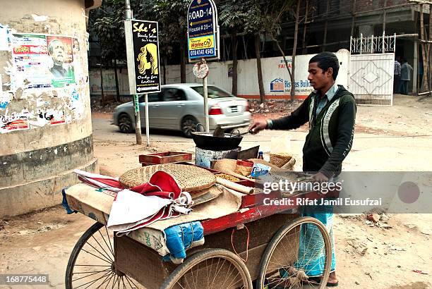 Zahirul Islam sells beans/nuts in the streets of Uttara, Dhaka . He has a four wheel push cart to carry all the beans, nuts etc as well as other...