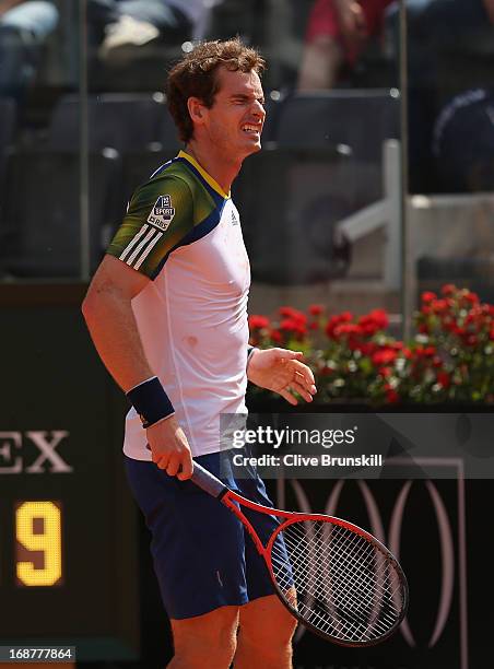 Andy Murray of Great Britain reacts against Marcel Granollers of Spain before withdrawing due to injury at the end of the second set in their second...