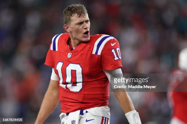Mac Jones of the New England Patriots reacts after officials overturned a spot to turn the ball over and end the game \amia at Gillette Stadium on...