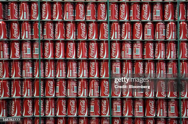 Completed aluminium cans produced for Coca-Cola Co.'s Coke drink sit stored ahead of shipping at Rexam Plc's beverage can plant in Wakefield, U.K.,...