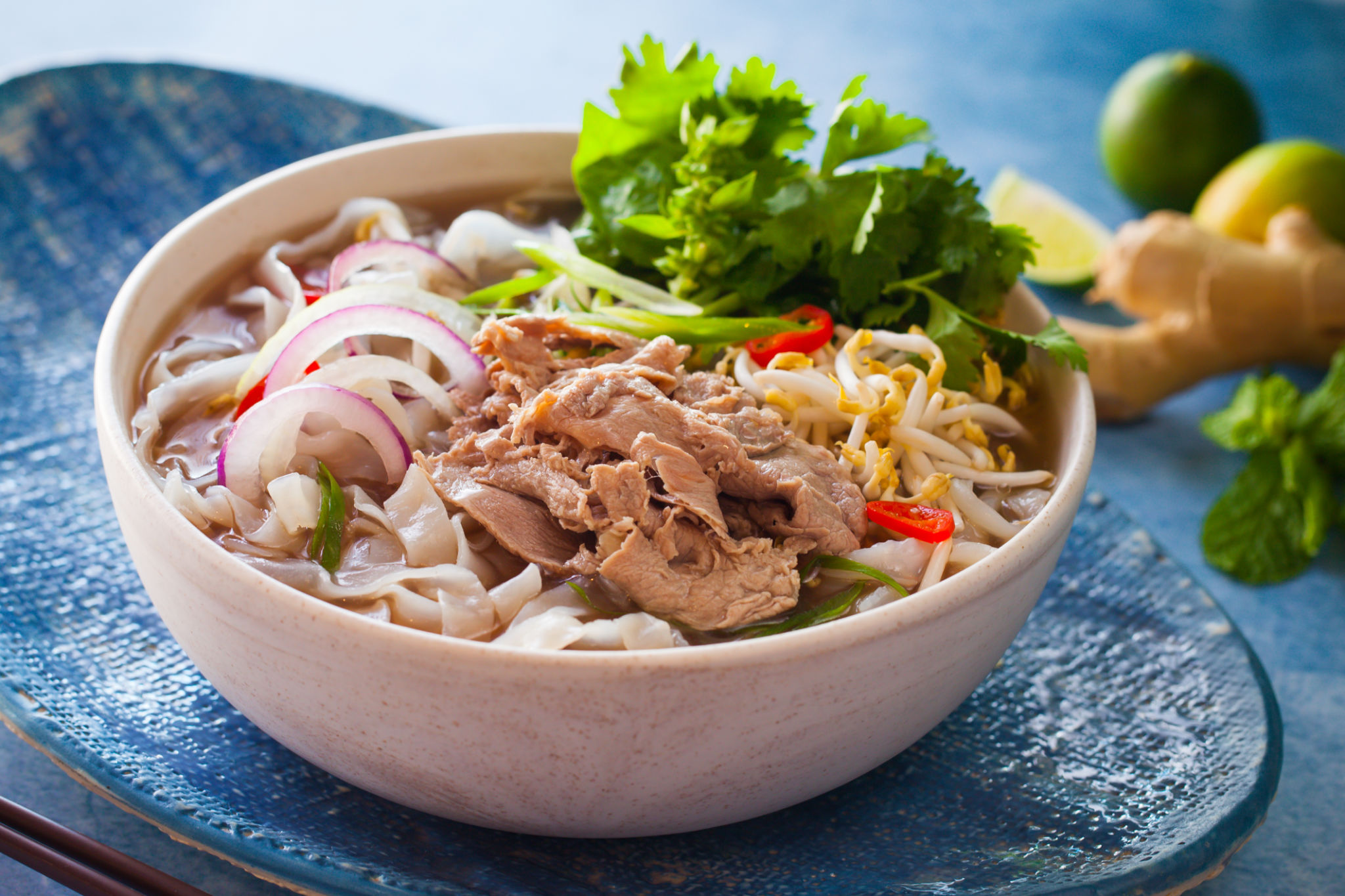 Traditional beef pho with herbs and lime in Vietnam Traditional beef pho with herbs and lime in Vietnam
