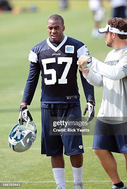 DeViont Holloman talks with an coaching assistant concluding the afternoon practice of the Dallas Cowboys Rookie Minicamp at Dallas Cowboys...