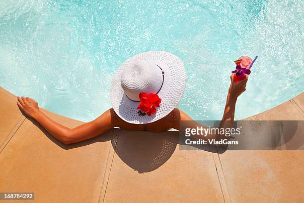 woman relaxing in an outdoor hot tub - pool refreshment stock pictures, royalty-free photos & images
