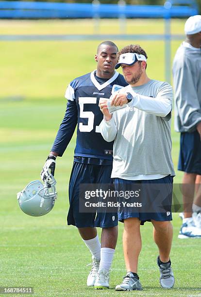 DeViont Holloman talks with an coaching assistant concluding the afternoon practice of the Dallas Cowboys Rookie Minicamp at Dallas Cowboys...