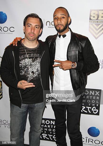 Damon Marks and Swizz Beatz attend the Bronx Charter School for the Arts 2013 art auction at Marquee on May 14, 2013 in New York City.