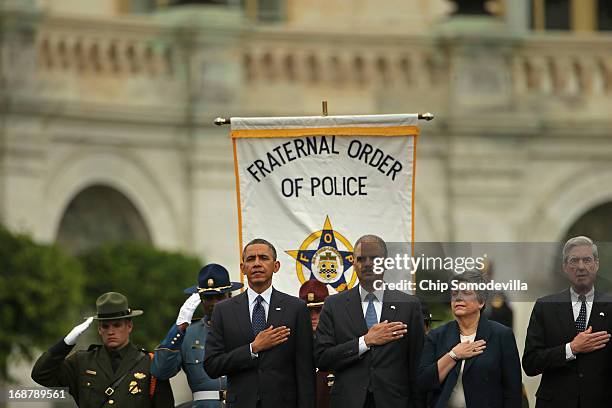 President Barack Obama, Attorney General Eric Holder, Homeland Security Secretary Janet Napolitano and FBI Director Robert Mueller attend the...