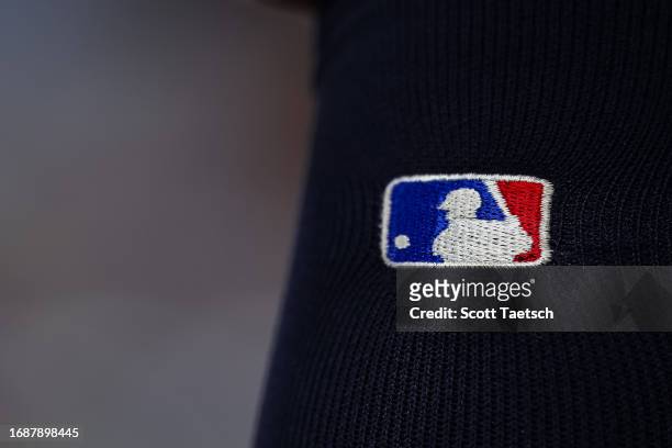 View of the MLB logo on the uniform worn by Rene Pinto of the Tampa Bay Rays during the third inning against the Baltimore Orioles at Oriole Park at...