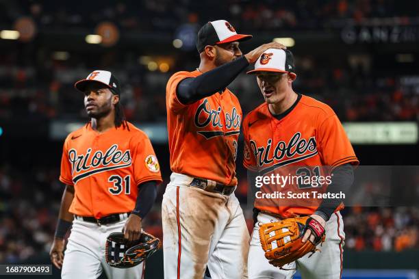 Austin Hays of the Baltimore Orioles celebrates with Aaron Hicks after making a play against the Tampa Bay Rays during the seventh inning at Oriole...