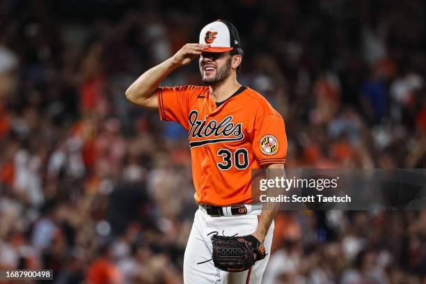 Grayson Rodriguez of the Baltimore Orioles celebrates after the final out of the seventh inning against the Tampa Bay Rays at Oriole Park at Camden...