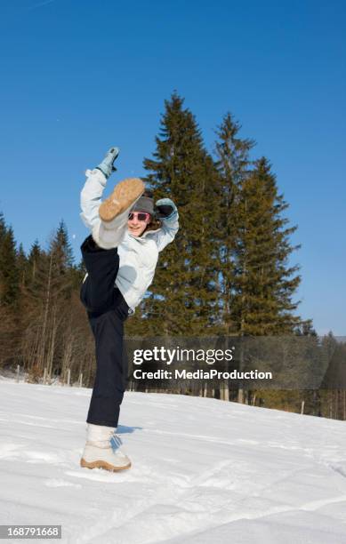 wintert fun - boot kicking stock pictures, royalty-free photos & images