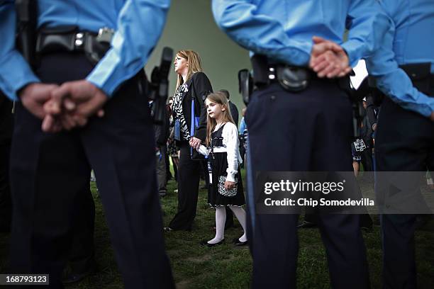Family members of 143 law enforcement officers who died in 2012 arrive for the National Peace Officers' Memorial Service at the U.S. Capitol May 15,...