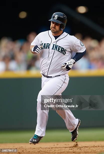 Kelly Shoppach of the Seattle Mariners rounds the bases after hitting a two-run home run in the fifth inning against the Oakland Athletics at Safeco...