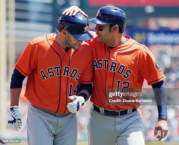 Martinez of the Houston Astros is congratulated by Carlos Pena after hitting a three-run home run against the Detroit Tigers in the fourth inning at...